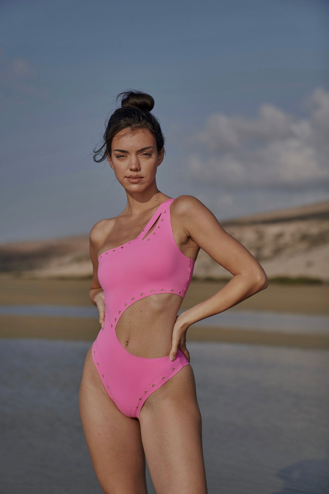 Model wears WISKII One Shoulder Laser Cut Swimsuit