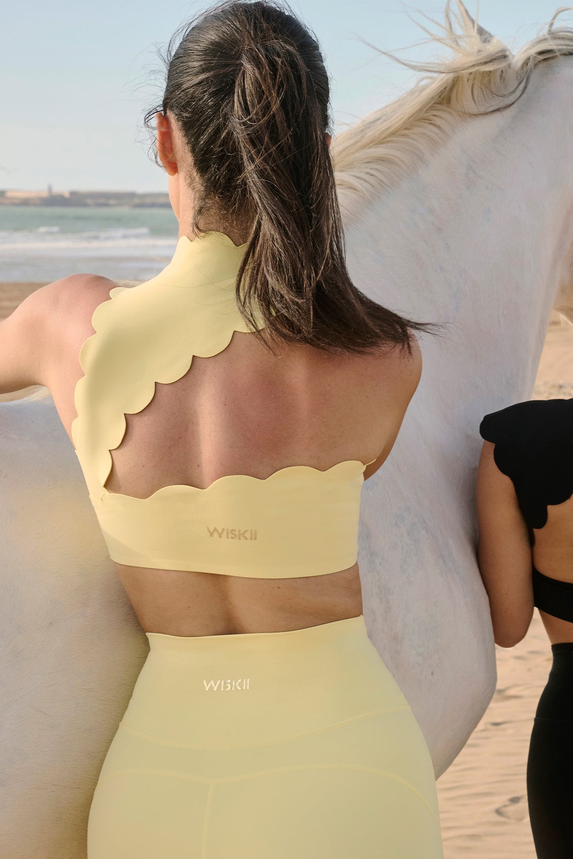 Model wears Scallop Back Mock Neck Bra | WISKII ACTIVE