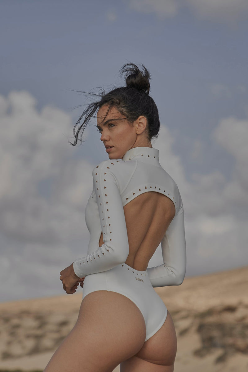 Model wears WISKII Long Sleeve Open Back Laser Cut Surfsuit