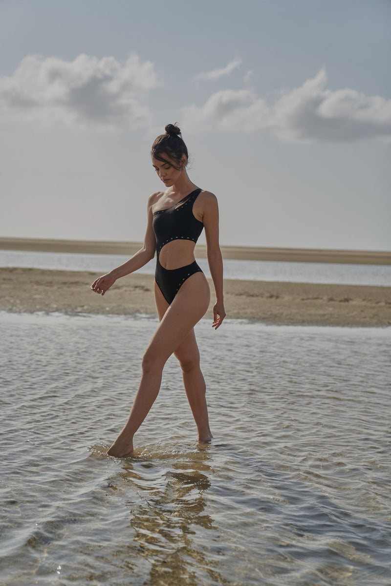 Model wears WISKII One Shoulder Laser Cut Swimsuit