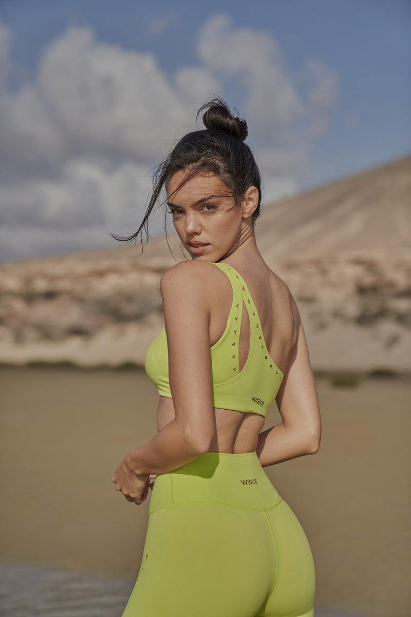 Model wears WISKII One-shoulder Laser Cut Sports Bra | WISKII ACTIVE