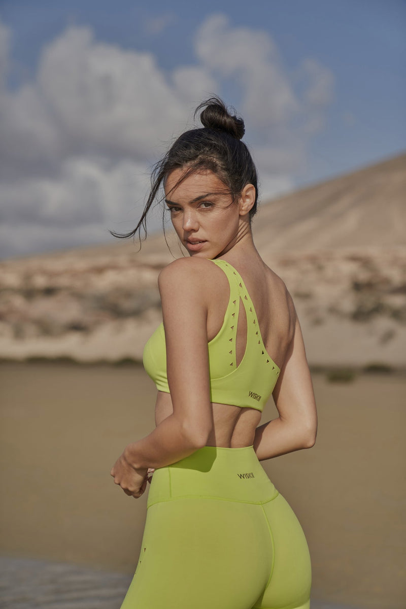 Model wears WISKII One-shoulder Laser Cut Sports Bra