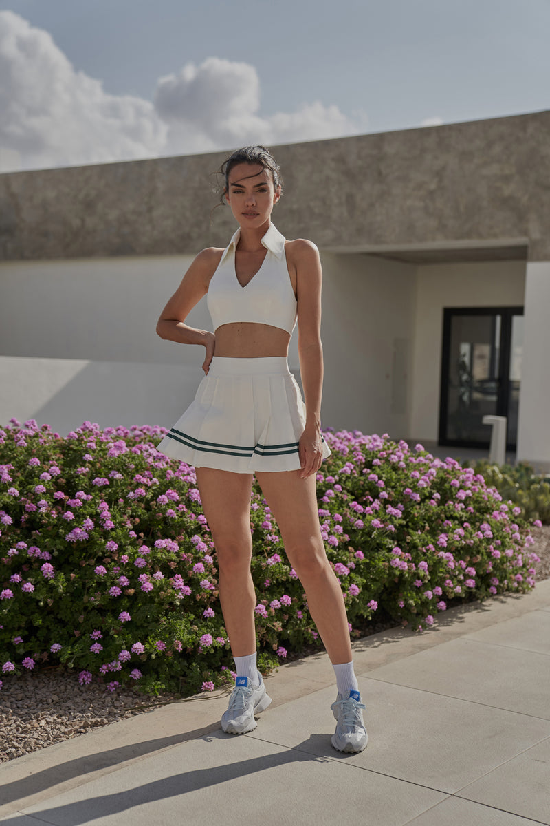 Model wears WISKII Varsity Tennis Skirt