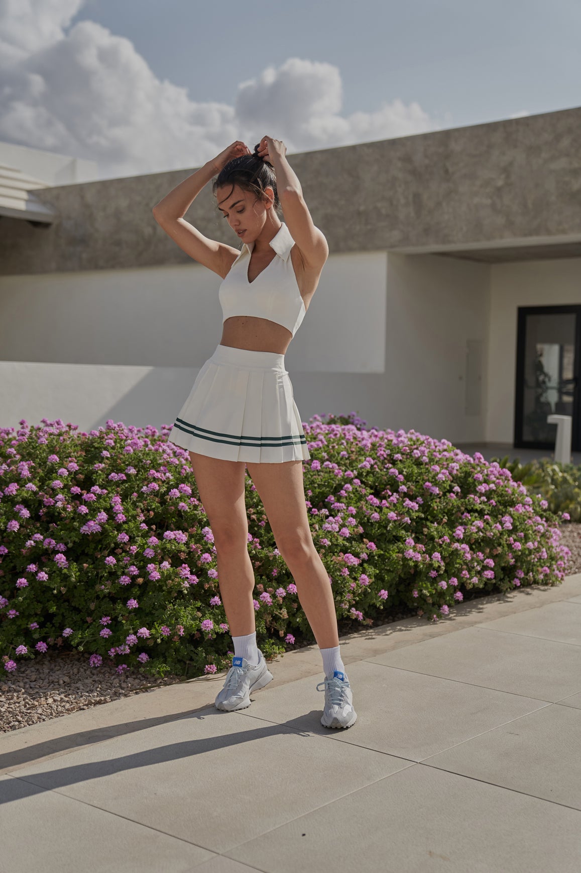 Model wears WISKII Varsity Tennis Skirt