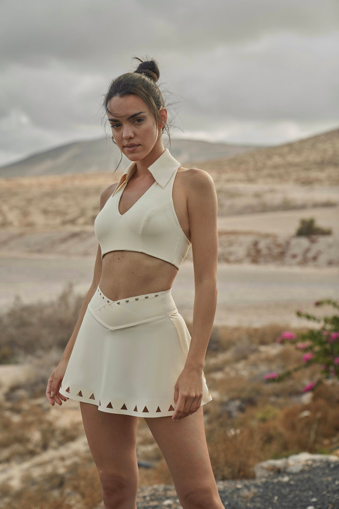 Model wears WISKII V-waist Laser Cut Tennis Skirt