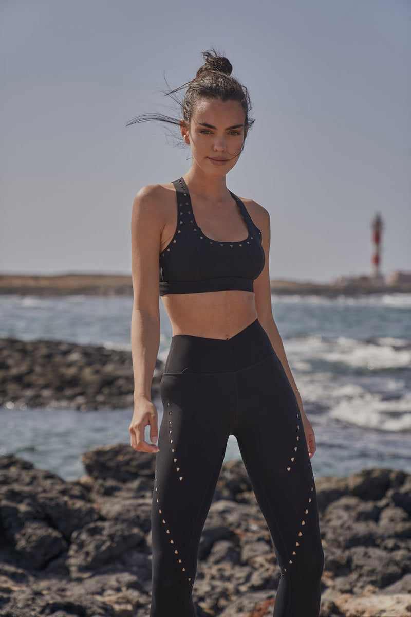 Model wears WISKII Racerback Laser Cut Sports Bra