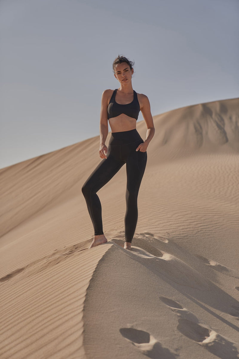 Model wears Dreamy Cutout Yoga Bra + High-Waist Invigorate Legging | WISKII