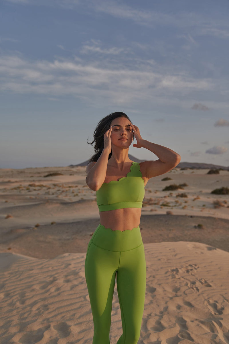 Model wears Dynamic One Shoulder Sports Bra + 7/8 High-Waist Energy Legging | WISKII