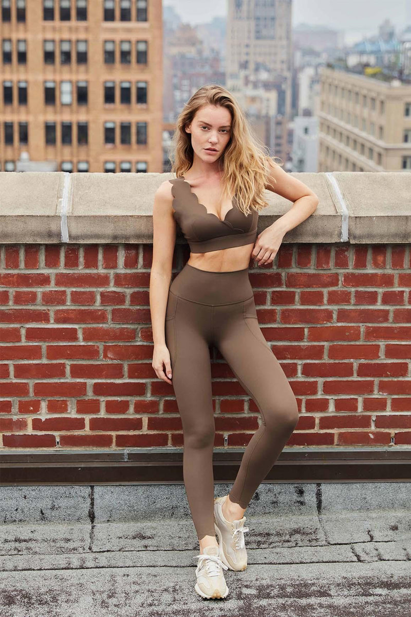 model wears WISKII Olive Green Soufflé Sports Bra pare with legging