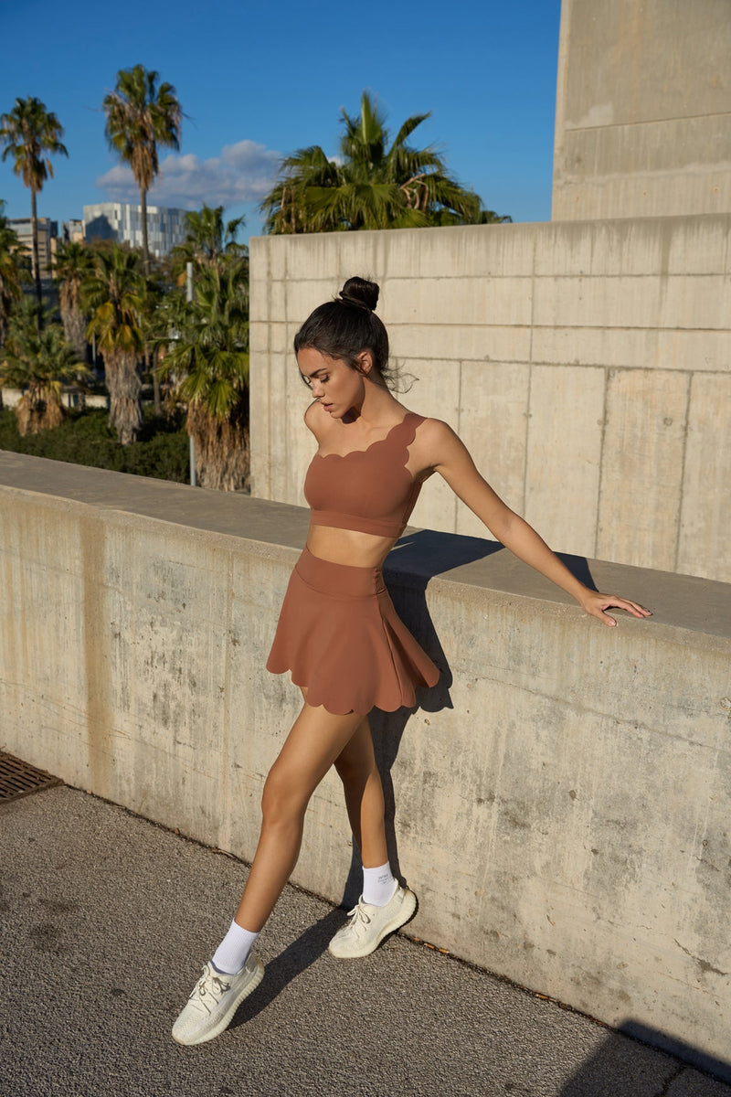 Moder wears HIGH-WAIST A-LINE TENNIS SKIRT