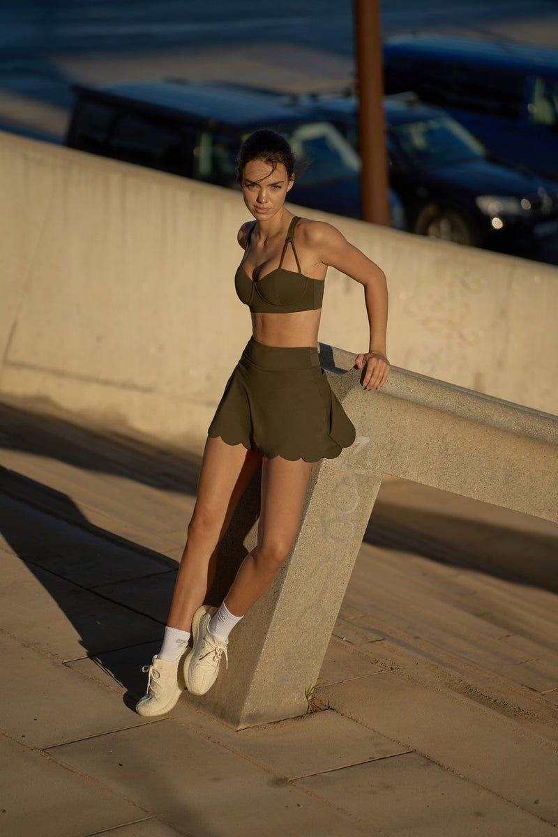 Model wears WISKII high waist a line tennis skirt