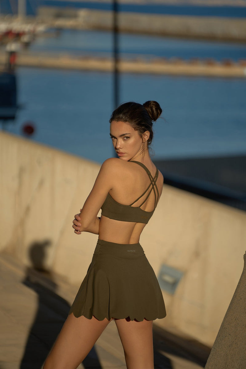 Model wears WISKII high waist a line tennis skirt