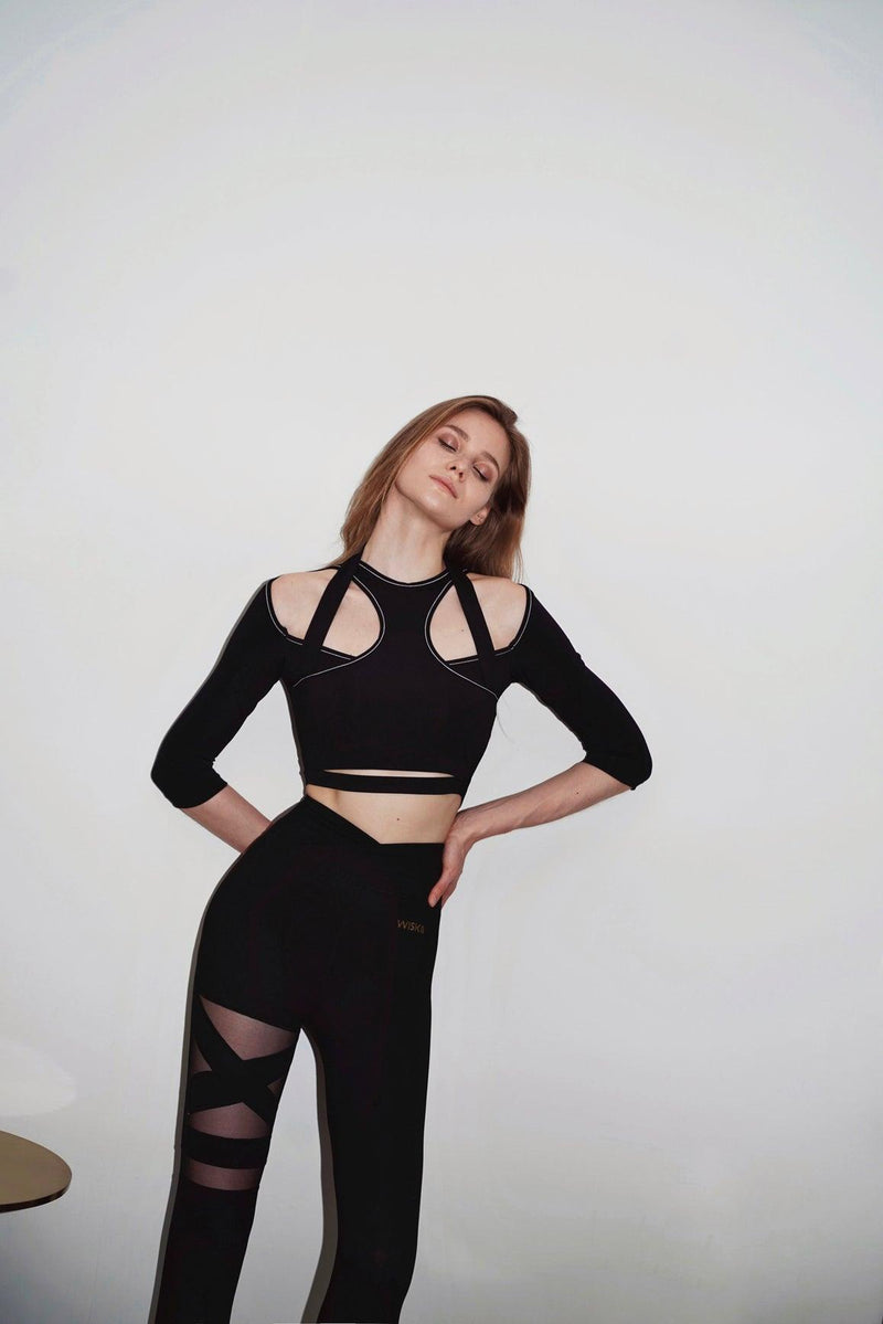 model wears a WISKII flex sports 3/4 sleeve crop top